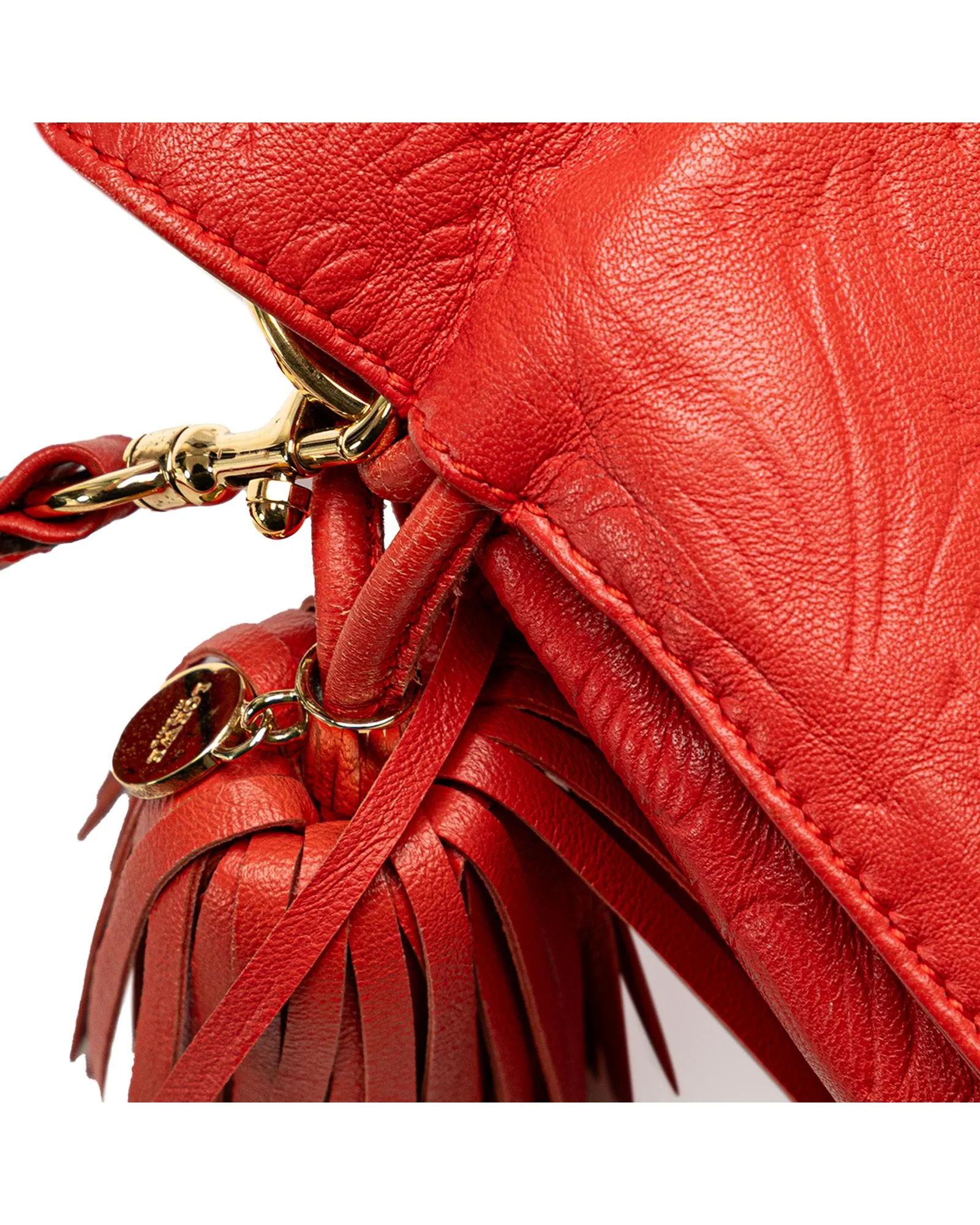 Embossed Leather Flamenco Tassel Crossbody Bag with Snap Closure